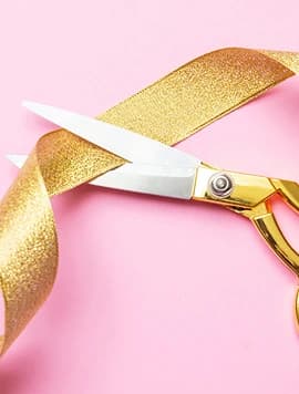 Pink gift box with gold ribbon